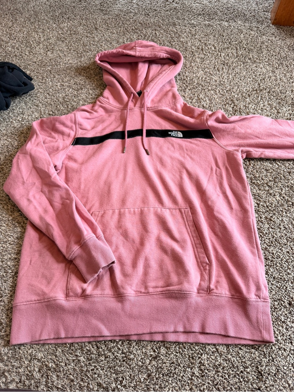The North Face women’s Pink Hoodie with Black Chest Stripe